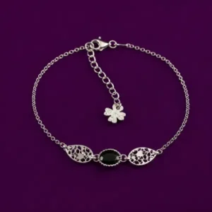 Black onyx bracelet with silver chain, filigree beads, and flower charm