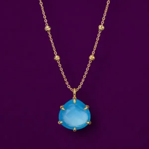 Blue chalcedony necklace worn to show its calming benefits and meaning