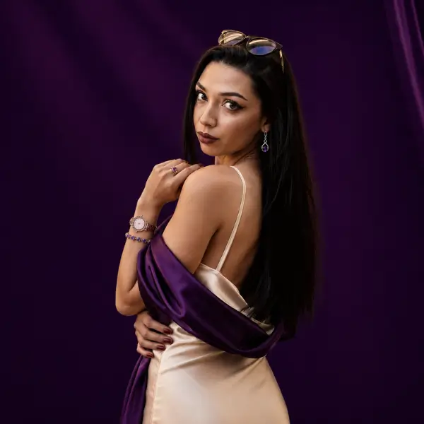 Silvia wearing February birthstone jewelry from Solenné's amethyst jewelry collection