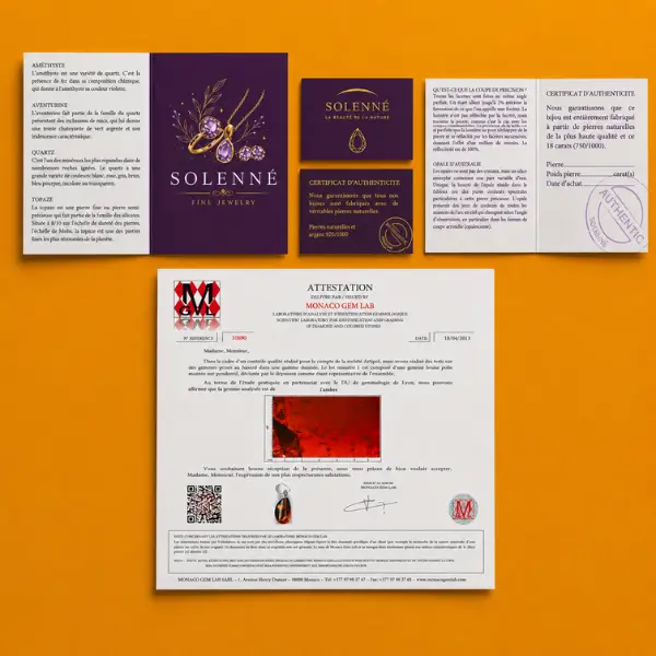 Solenné certificates of authenticity for gemstones and precious metals laid out on a branded background