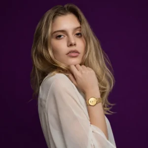 Corina wearing a gold plated watch for ladies from the Solenne Art of Gift collection